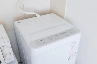 a white washer and dryer in a kitchen at Joyful JUJO Stay 1minute walk from JR Jujo Station Shibuya 15min Shinjuku 11min Ikebukuro 6min Max 6guests 33square meters Simmons bed in Tokyo
