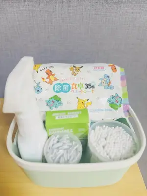 a basket filled with toilet paper and other toiletries at Shinjuku\u65b0\u5bbf\u516c\u5712 in Tokyo