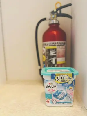 a fire hydrant and a container of food next to a fire hydrant at Shinjuku\u65b0\u5bbf\u516c\u5712 in Tokyo