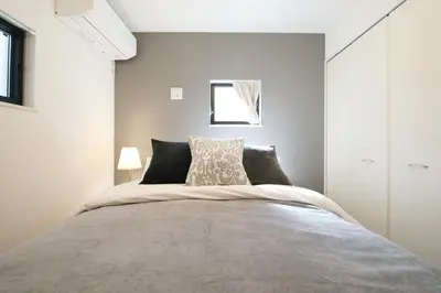a bedroom with a large bed in a room at Skytree Neighbors close to Asakusa & Tokyo Skytree in Tokyo
