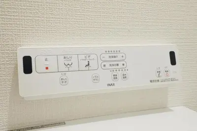 a white control panel of an oven with buttons at Skytree Neighbors close to Asakusa & Tokyo Skytree in Tokyo