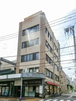 a tall building on the corner of a street at Ueno Asakusa 2 in Tokyo