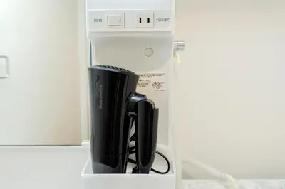 a coffee pot is sitting in a refrigerator at Oakville Nezu by Tranova in Tokyo