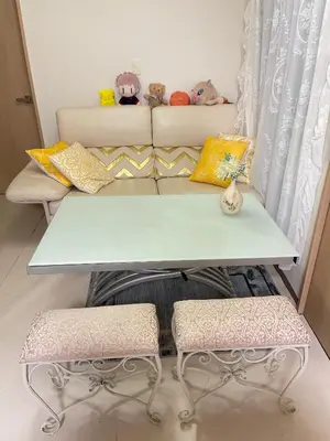 a table and two stools in front of a couch at \u671b\u6708\u30cf\u30a6\u30b9101 in Tokyo