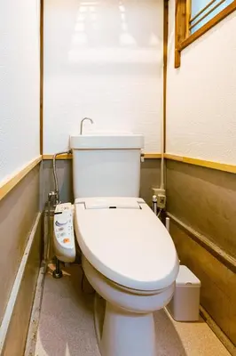 a bathroom with a white toilet in a room at 1ST BASE ICHINOE 3BR House 13 Guests Disney 30min NRT Bus in Tokyo