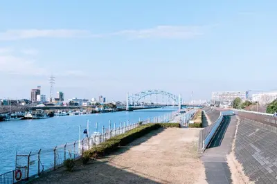 a view of a river with a bridge in the background at 1ST BASE ICHINOE 3BR House 13 Guests Disney 30min NRT Bus in Tokyo