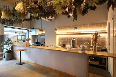 a large kitchen with a counter in a restaurant at E10 Hostel in Tokyo