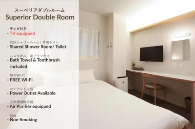 a hotel room with a bed and a desk at E10 Hostel in Tokyo