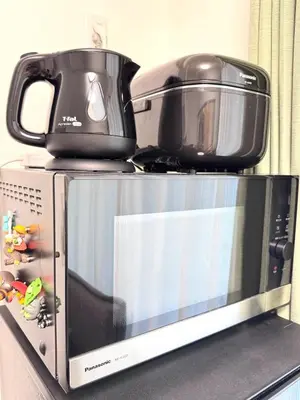 a microwave with a toaster oven on top of it at Motosakura 401 Asakusa Ueno Akihabara Area, Bicycle Rental, 6 Minutes to Station, 2 Simmons Beds, Elevator, Direct Access to Airport in Tokyo