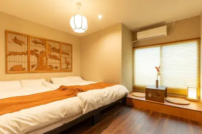 a bedroom with a large bed and a window at \u6674\u30ec\u5c4b \u7b51\u6ce2\u8358 Hareya Tsukubaso in Tokyo