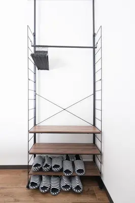 a shelf with shoes on it in a room at \u5317\u5c0f\u5ca9\u6238\u5efa in Tokyo