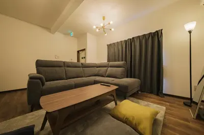 a living room with a couch and a table at \u5317\u5c0f\u5ca9\u6238\u5efa in Tokyo