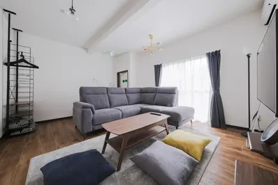 a living room with a couch and a table at \u5317\u5c0f\u5ca9\u6238\u5efa in Tokyo