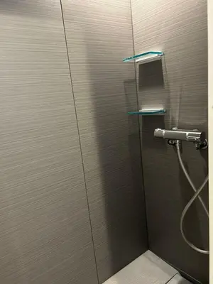 a shower in a bathroom with a metal wall at ying-Dōgenzaka,Shibuya city 3F-SY0065 in Tokyo
