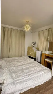 a bedroom with a large white bed in it at \u671b\u6708\u30cf\u30a6\u30b9201 in Tokyo