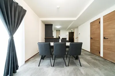 a dining room with a table and chairs at 1, Horikiri Entire house for rent, \u5800\u5207 in Tokyo