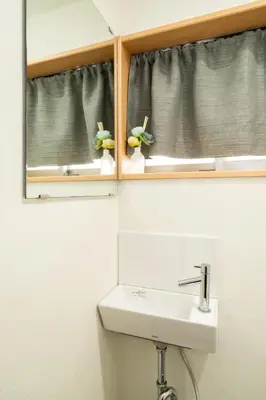 a bathroom with a sink and a mirror and a window at 1, Horikiri Entire house for rent, \u5800\u5207 in Tokyo