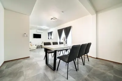 a dining room with a table and chairs at 1, Horikiri Entire house for rent, \u5800\u5207 in Tokyo