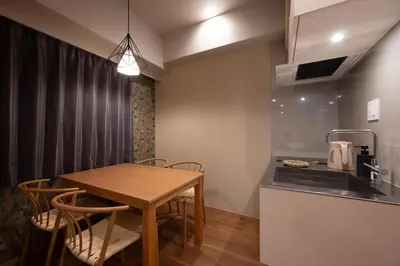 a kitchen and dining room with a table and chairs at EISEI STAY Ikebukuro Nishi in Tokyo