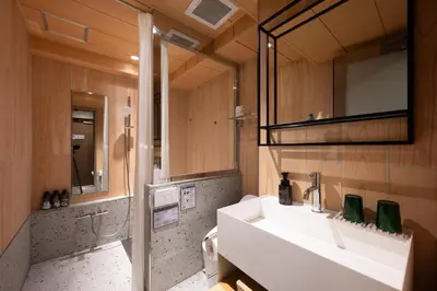a bathroom with a sink and a mirror at EISEI STAY Ikebukuro Nishi in Tokyo