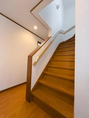 a staircase in a house with wooden floors and white walls at Akira Hiro House - Room101 in Tokyo