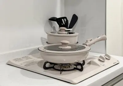 a mortar and pestle with utensils sitting on a counter at ef\u6c60\u888b301 in Tokyo