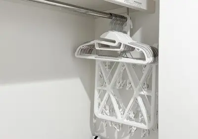 a towel rack in a laundry room with white at ef\u6c60\u888b301 in Tokyo