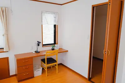 a room with a desk and a chair and a mirror at Akira Hiro House - Room201 in Tokyo