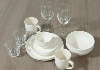 a table topped with white plates and wine glasses at ef\u6c60\u888b303 in Tokyo