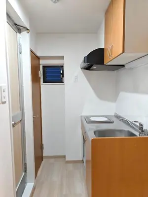 a small kitchen with a sink and a stove at THE ONE kouennji in Tokyo