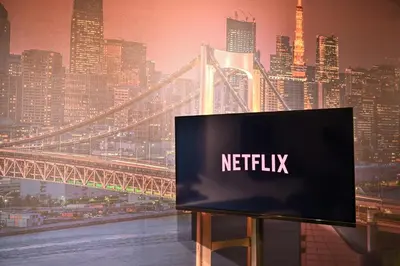 a television with the netflix sign in front of a city at OMORI Red&Blue Hotel in Tokyo