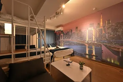 a hotel room with a city mural on the wall at OMORI Red&Blue Hotel in Tokyo