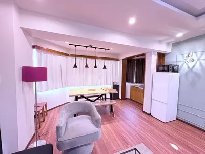 a kitchen and living room with a table and a chair at Spacious Family Stay Shinagawa-Kokoro House 3 in Tokyo