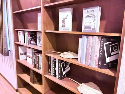 a book shelf filled with books in a room at Spacious Family Stay Shinagawa-Kokoro House 3 in Tokyo