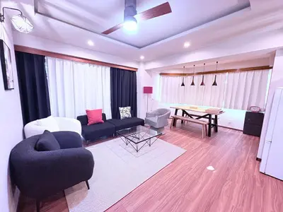 a living room with a couch and a table at Spacious Family Stay Shinagawa-Kokoro House 3 in Tokyo
