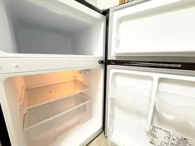 an open refrigerator with its door open and its at Shinjuku Waseda D1 in Tokyo