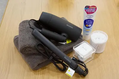 a wii remote sitting on top of a towel at BH Terrace Hirai 103 in Tokyo