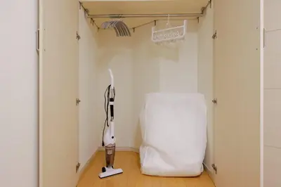 a room with a white hair dryer in a room at \u30d7\u30e9\u30c1\u30ca\u30b3\u30fc\u30c8\u5357\u9ebb\u5e03 in Tokyo