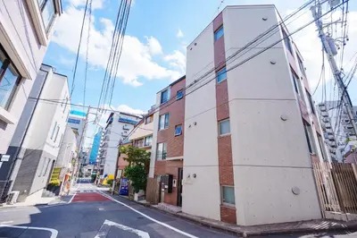 a building on the side of a street at NDZ102 3 min walk to station, 2 lines, Yamanote Line, explore Tokyo, high-speed Wi-Fi in Tokyo