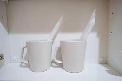 two white cups with knives sticking out of them at NDZ102 3 min walk to station, 2 lines, Yamanote Line, explore Tokyo, high-speed Wi-Fi in Tokyo