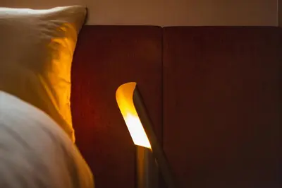 a close up of a book next to a bed at MU HEN KO Tokyo in Tokyo