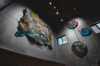 a room with several colorful umbrellas on the wall at MU HEN KO Tokyo in Tokyo