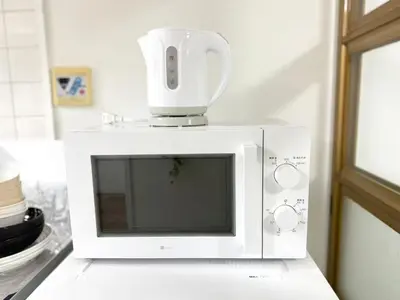 a white microwave with a blender on top of it at Shinjuku Waseda C4 in Tokyo