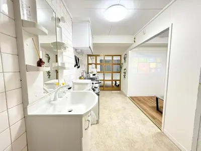 a bathroom with a sink and a mirror at Shinjuku Waseda C4 in Tokyo