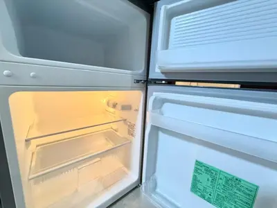an open refrigerator with its door open and its contents at Shinjuku Waseda Bravo 1 in Tokyo