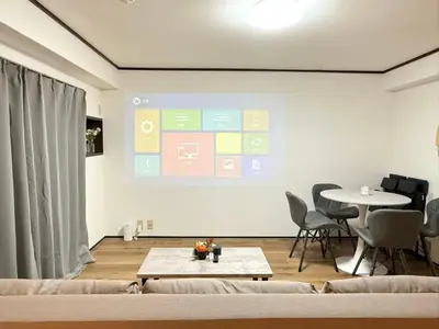a living room with a couch and a table at Shinjuku Waseda Bravo 1 in Tokyo