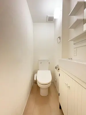a white bathroom with a toilet and a sink at Alley House 201 in Tokyo