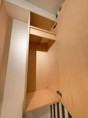 a room with a closet with wooden shelves at Alley House 201 in Tokyo