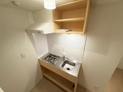 a small kitchen with a sink in a room at Alley House 201 in Tokyo