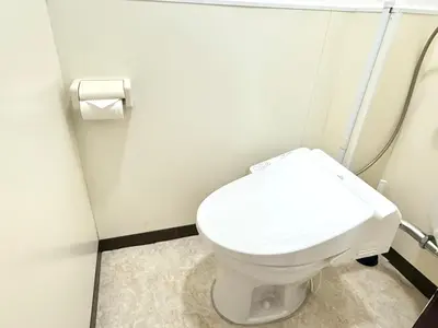 a bathroom with a white toilet in a stall at Shinjuku Waseda B3 in Tokyo